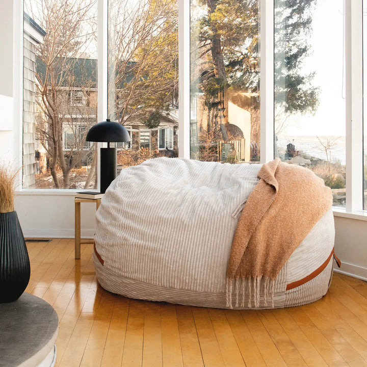 Fuf XXL Giant Bean Bag Chair full front view living room #color_vanilla-latte-corded-plush