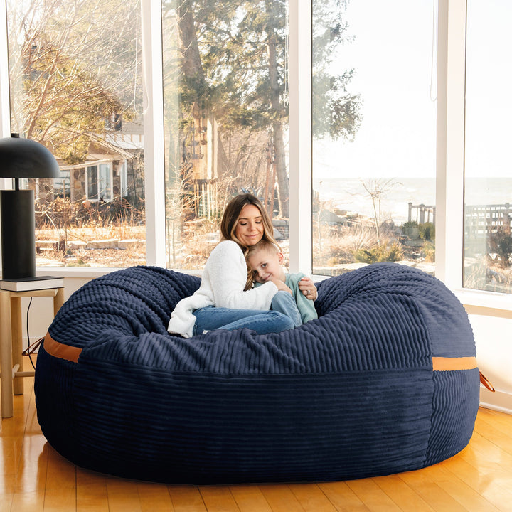 Woman and Son embracing on Fuf XXL Foam Beanbag  Midnight Blue Corded Plush #color_midnight-blue-corded-plush