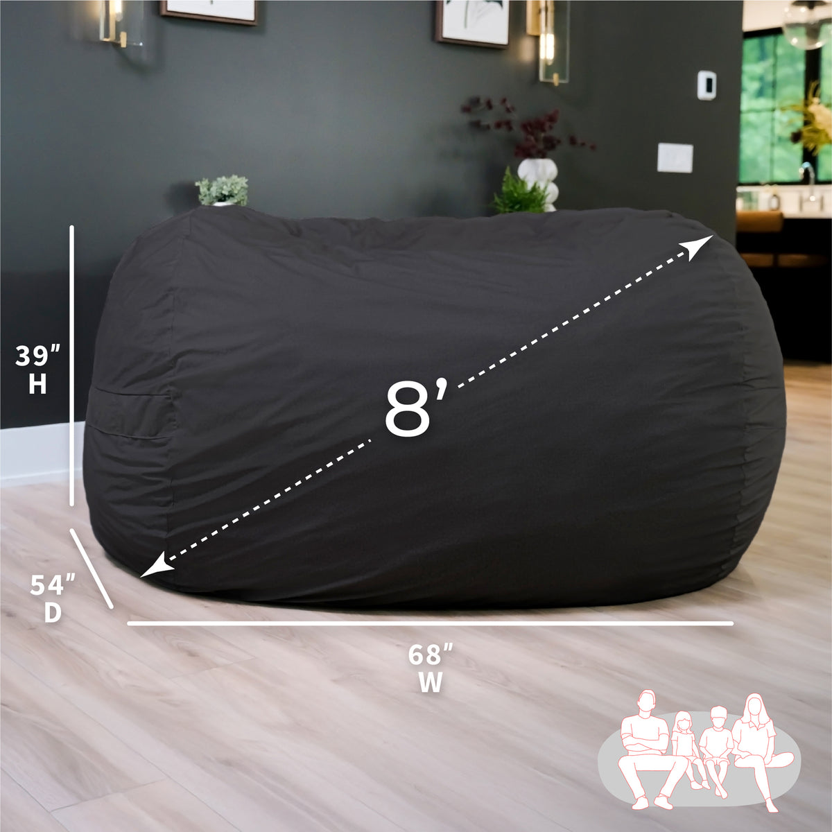Black bean bag chair with dimensions on a wooden floor.