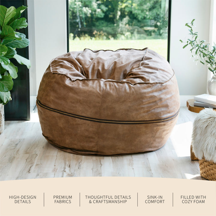 Brown bean bag chair in a room with plants and a window. #color_coffee-soft-vegan-leather