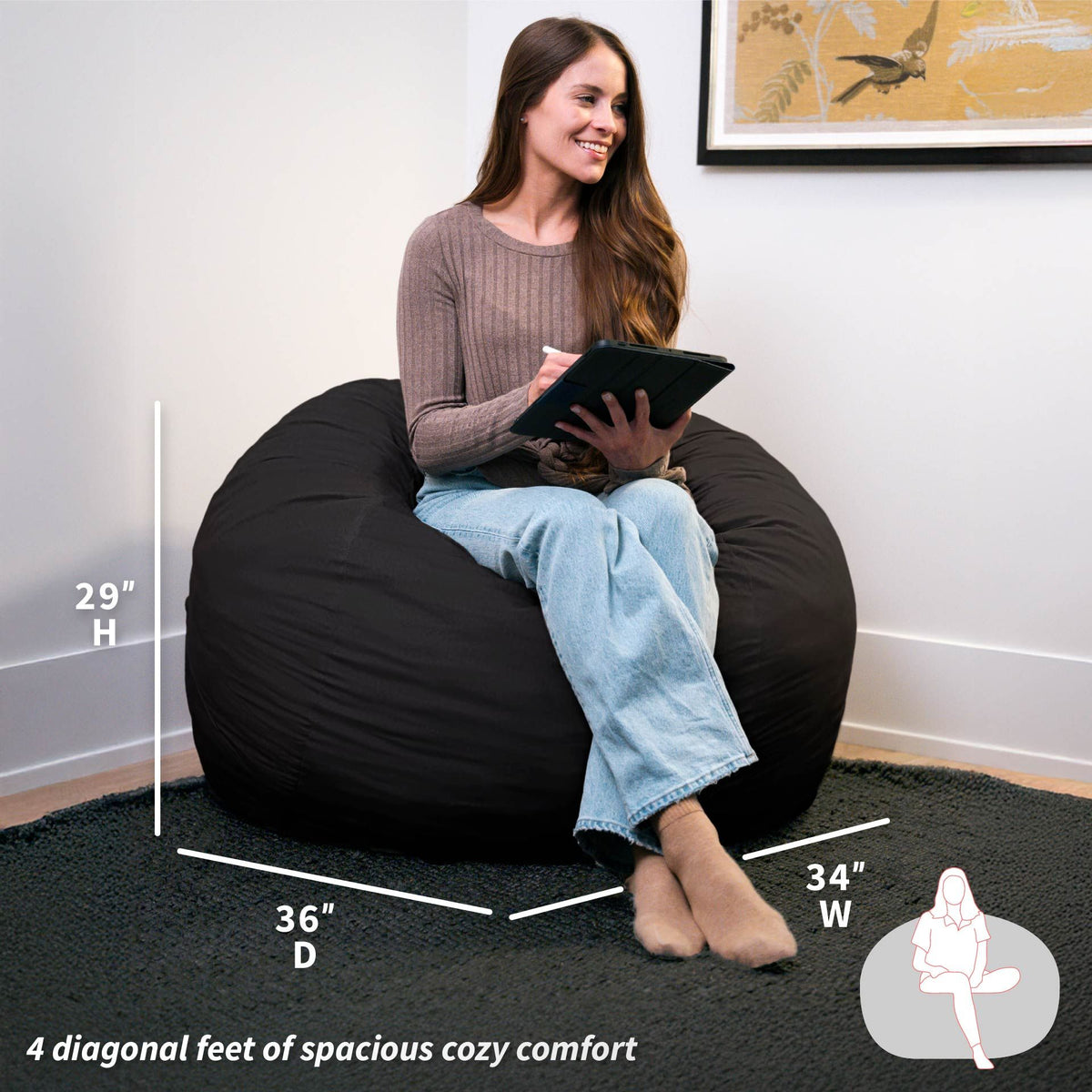 Woman sitting on a black bean bag chair with measurements displayed