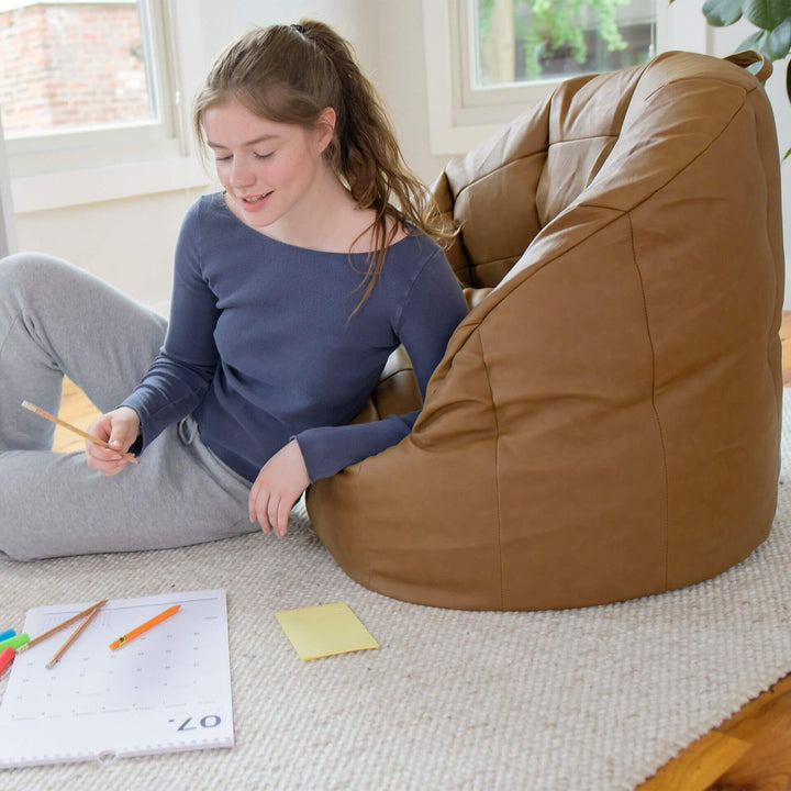 Do homework in comfort in the Milano Vibe Bean Bag Chair #color_caramel-vegan-leather