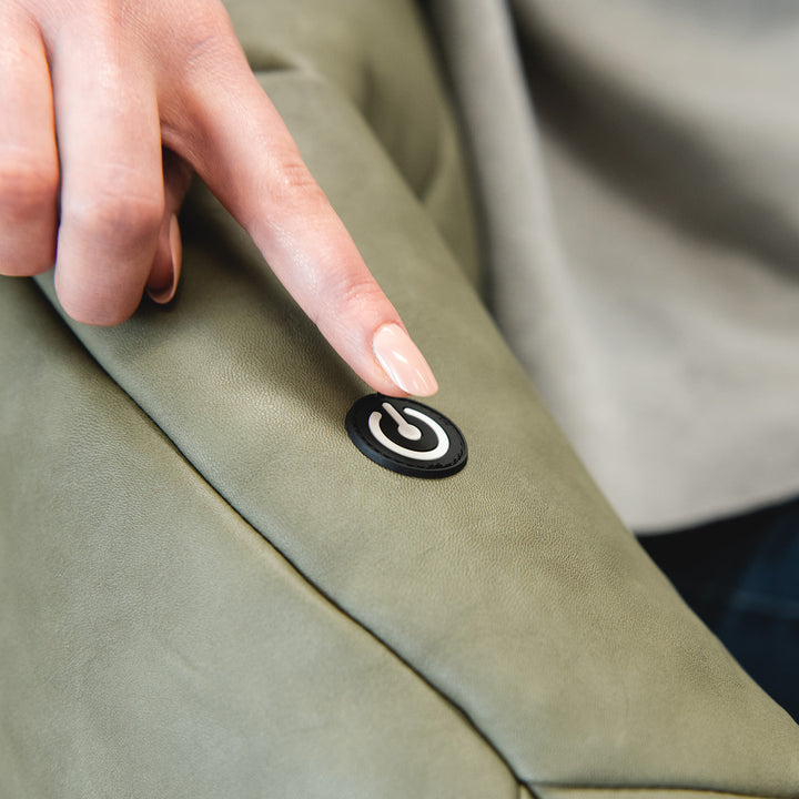 Power button to turn on the vibration feature. Milano with Vibe in Olive Green vegan leather #color_olive-green-vegan-leather