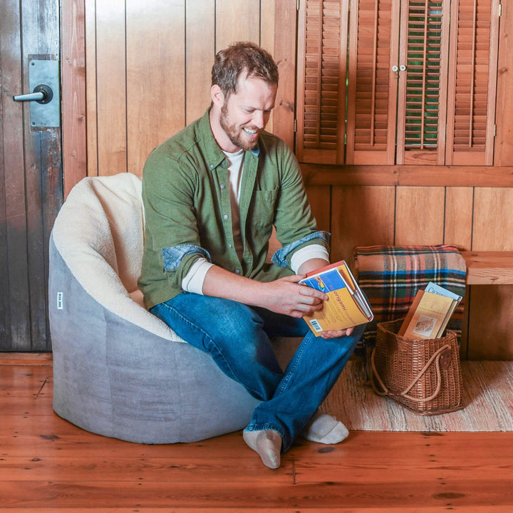 Milano sherpa suede beanbag chair man reading #color_graphite-sherpa-vegan-suede