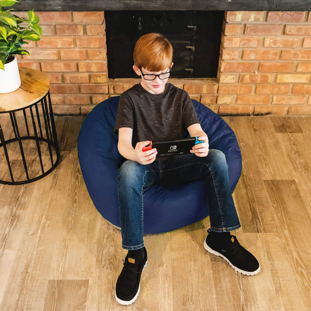 Boy on navy colored bean bag for kids #color_navy-smartmax