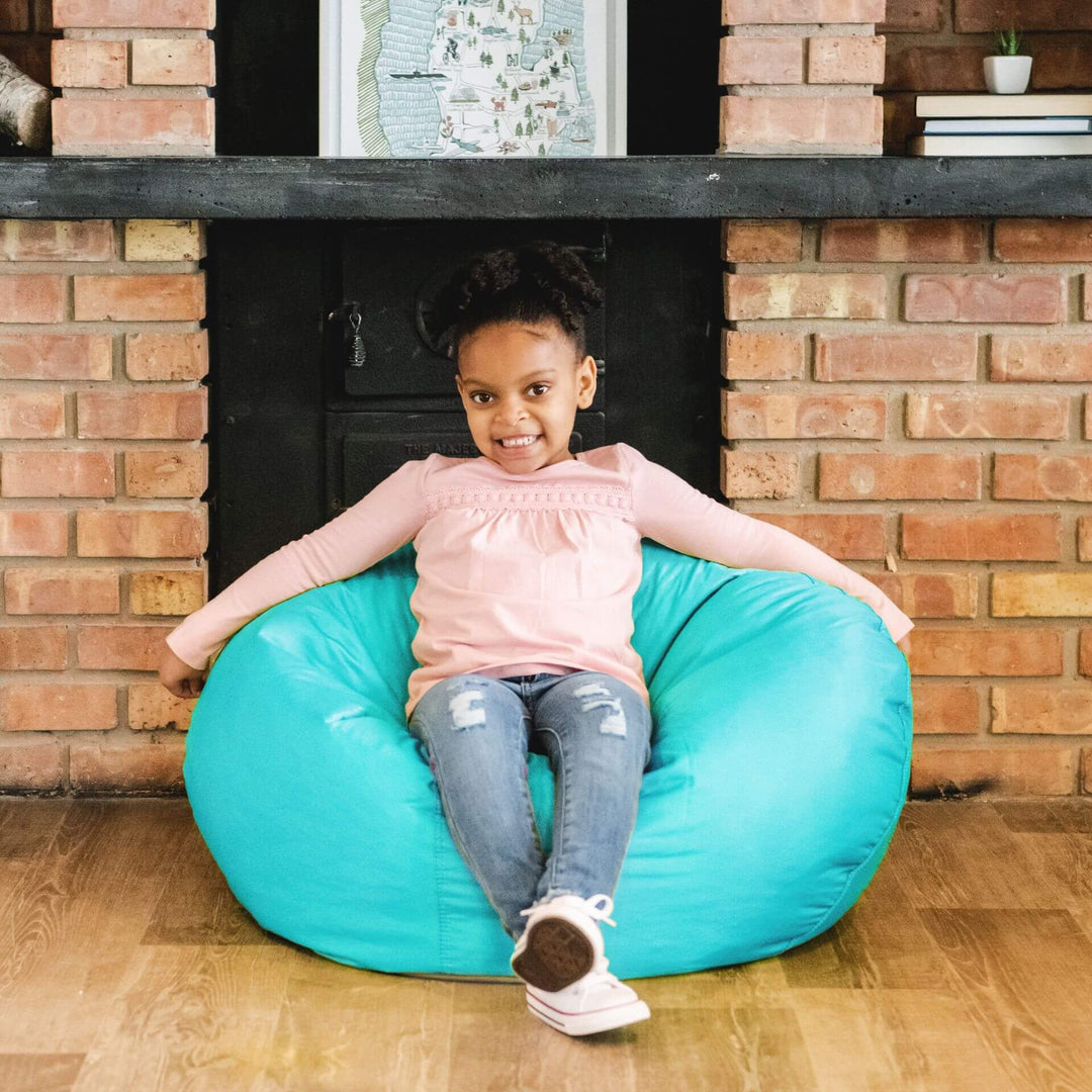 Girl on aqua bean bag for kids #color_aqua-smartmax