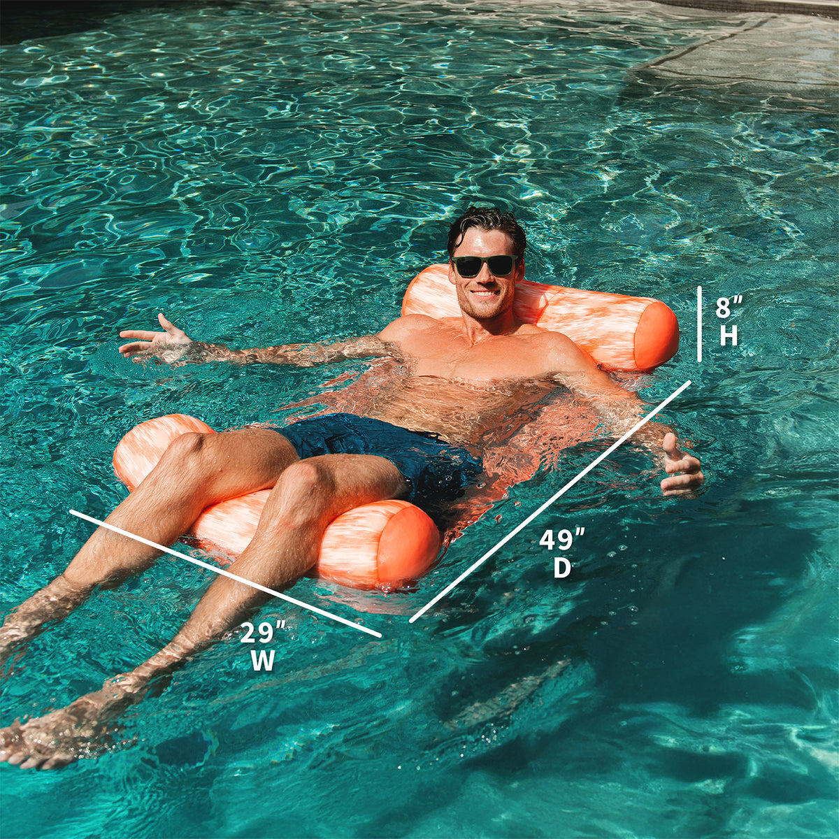 Man floating on an mesh bean hammock in a pool with measurements overlaid