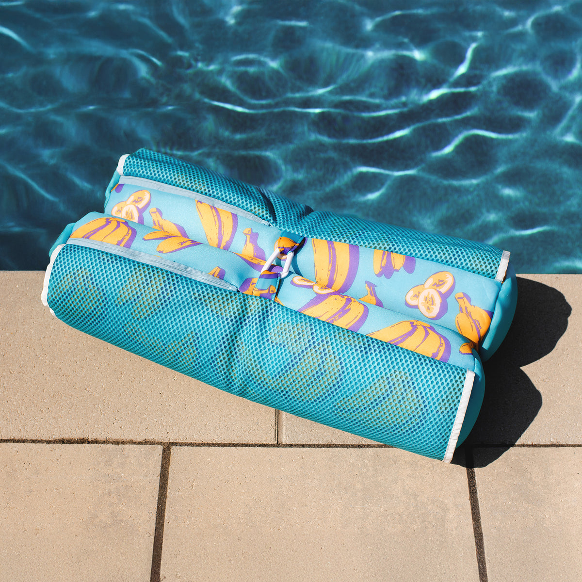 Banana Print Pool Hammock Float on a poolside