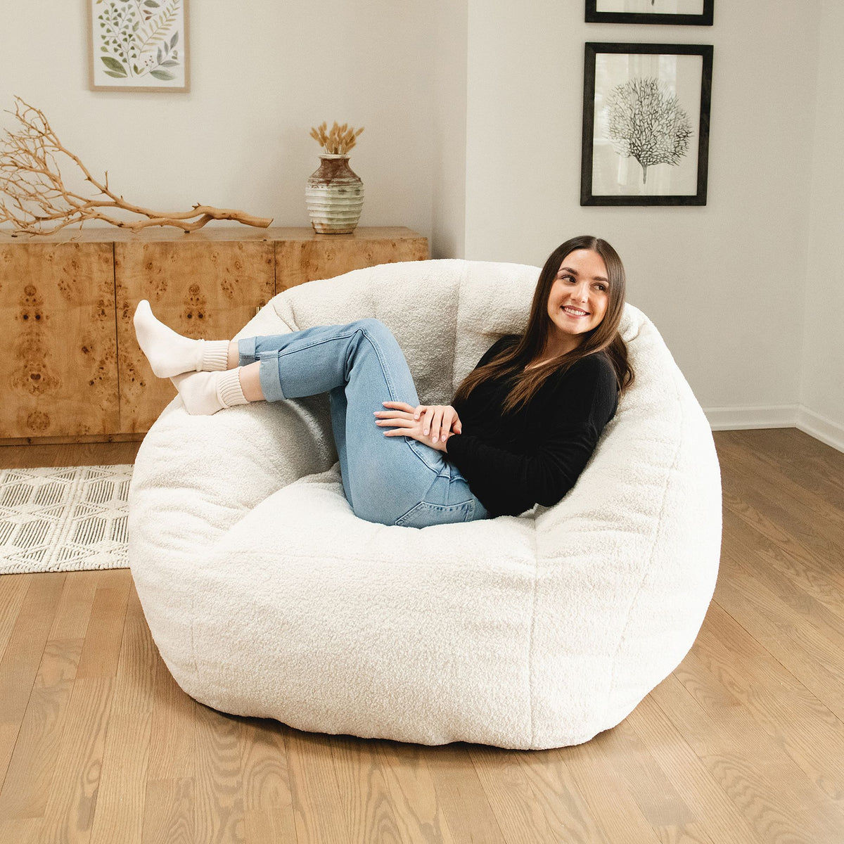 Girl laying back on a chair in the living room