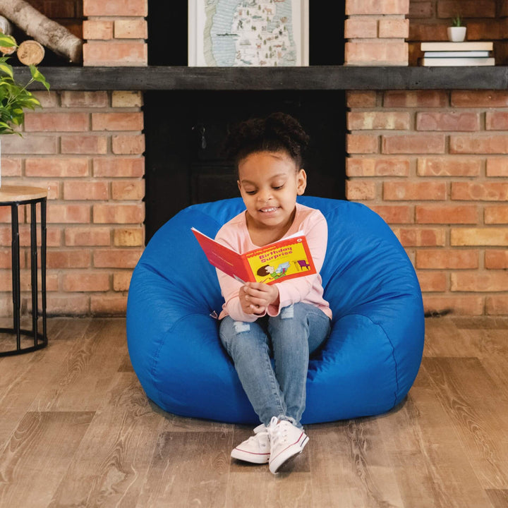 Girl reading on blue beanbag for kids #color_sapphire-smartmax