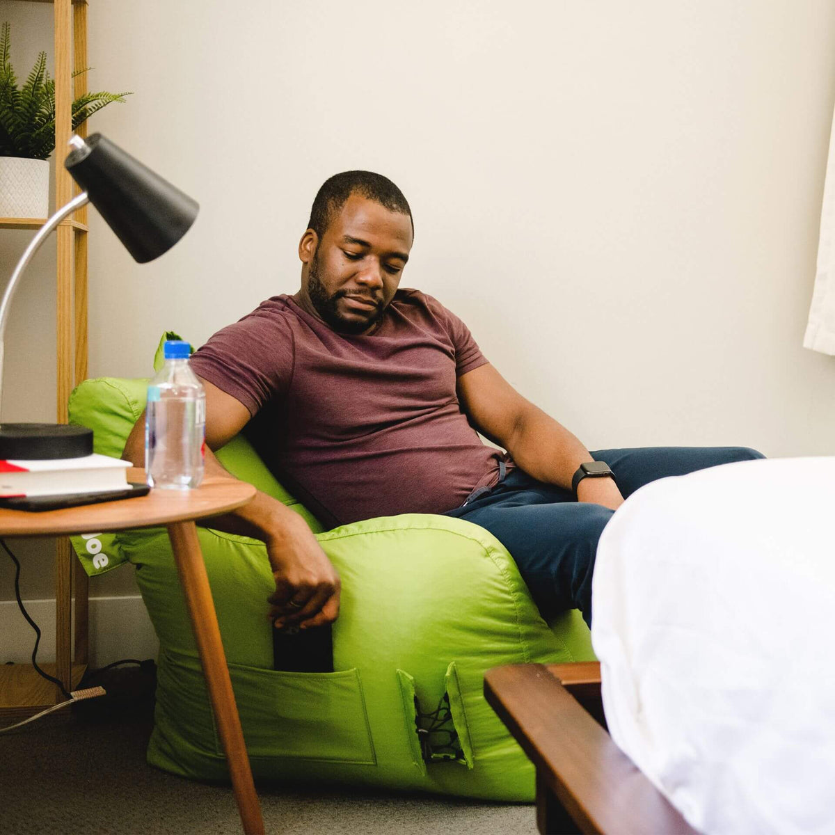 Green beanbag chair with pockets