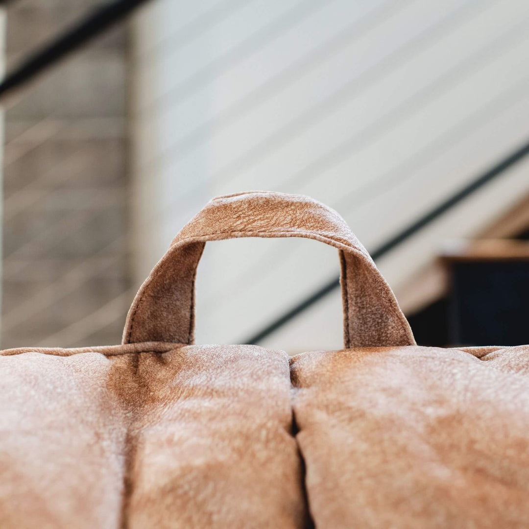 Tan Hug beanbag chair with carry handle #color_caribou-hyde