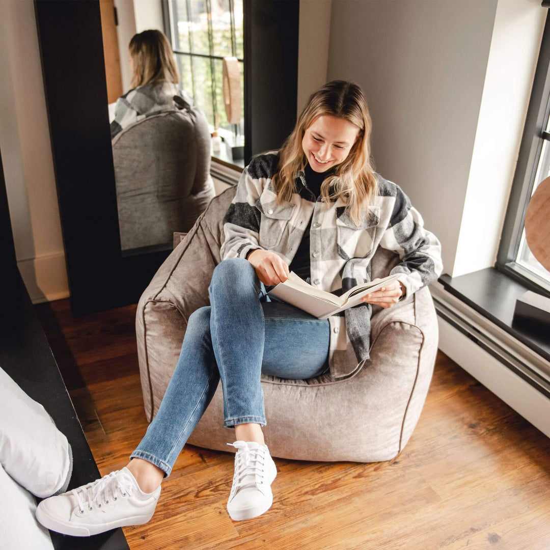 Woman on hug bean bag chair #color_lunar-gray-hyde