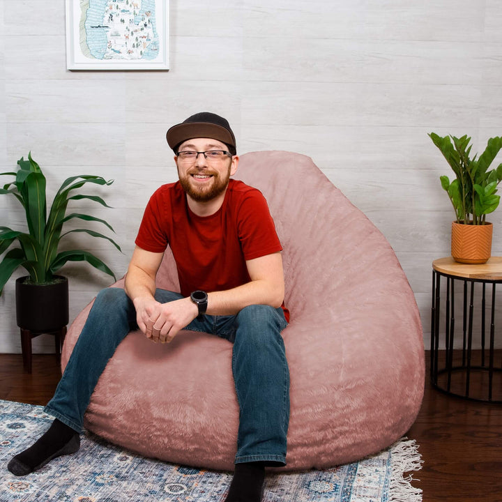 Man on shag foam beanbag chair #color_desert-rose-short-shag
