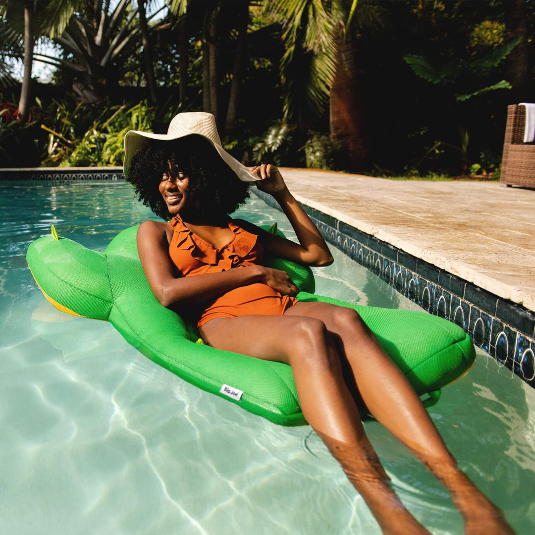 Cactus bean-filled pool float woman relaxing on water #color_cuddly-cactus