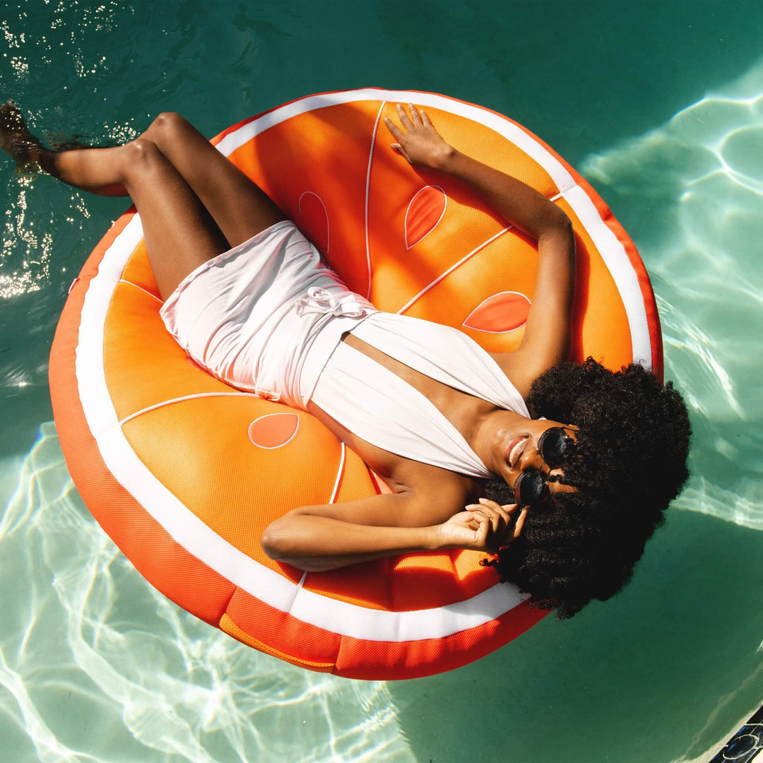 Bean Filled Pool Float shaped like orange lady relaxing in water #style_orange