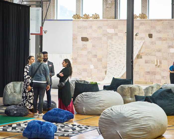 A group of people standing at the ArtPrize Opening