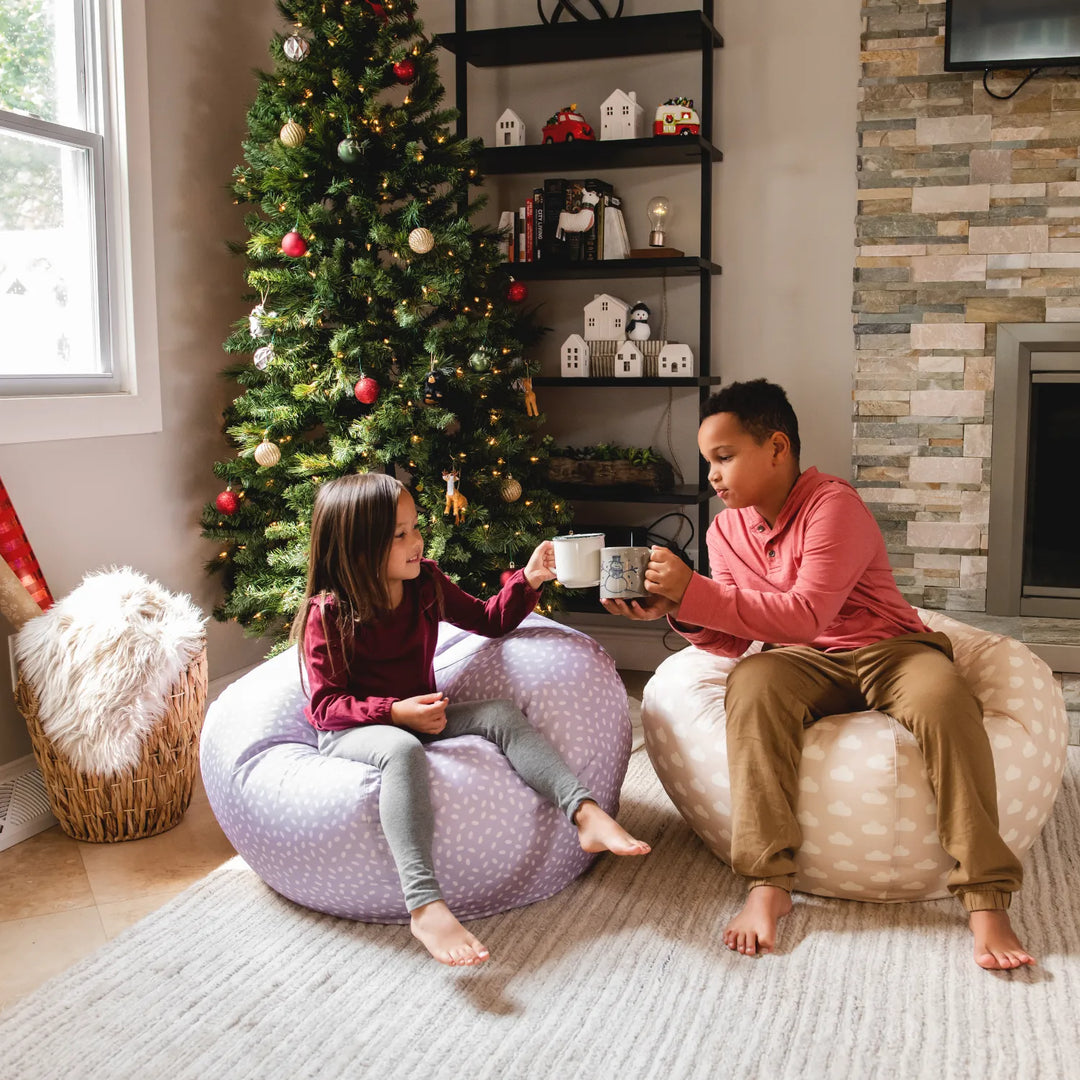 Little girl sitting in bean bag chair in living room