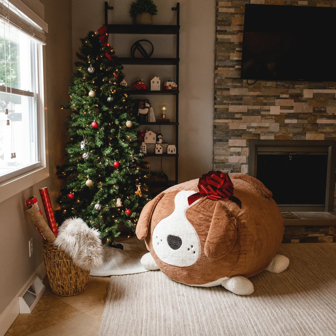 a little girl sitting on a large bean bag chair