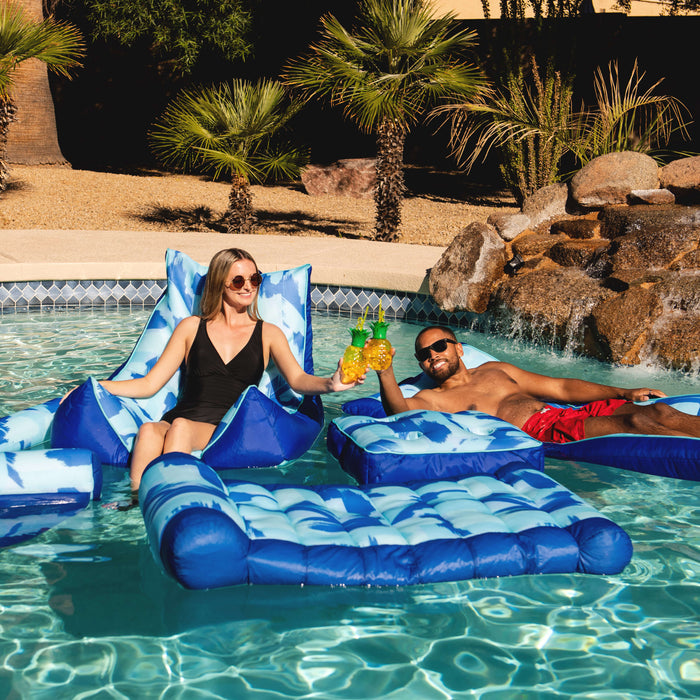 Man and women floating in a pool