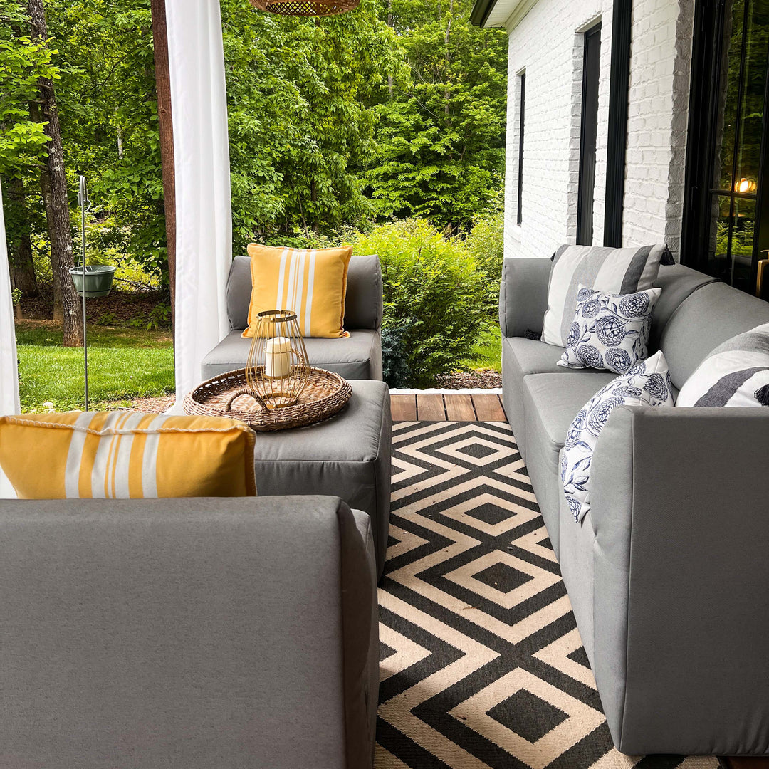 Outside photo during summer with patio furniture set