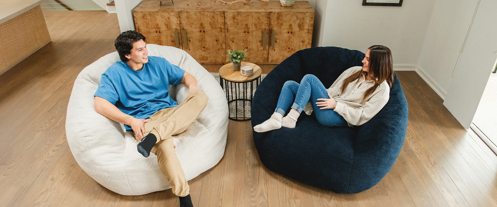 Couple sitting on two different colored foam filled Cloudberry Chairs