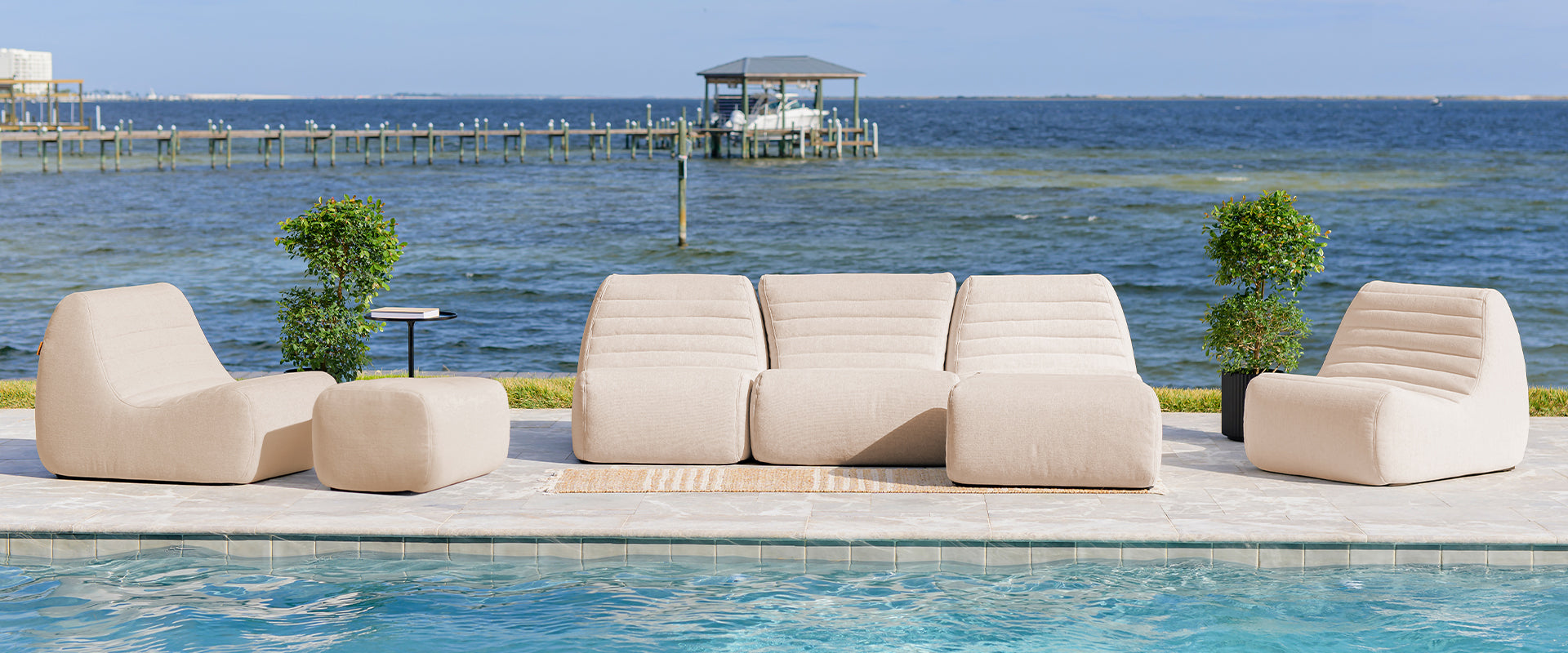 Outdoor Modular Sectionals - men relaxing on the patio sharing a drink on the outdoor sectional 5pc set