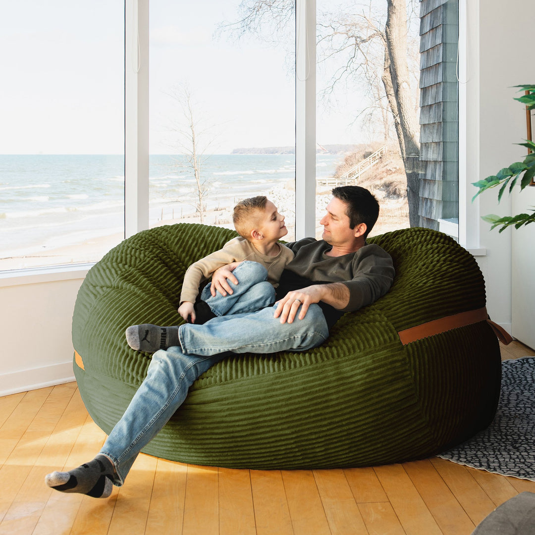 Father and son relaxing Big Joe Fuf XL Foam Beanbag Lounger Moss Green Corded Plush #color_moss-green