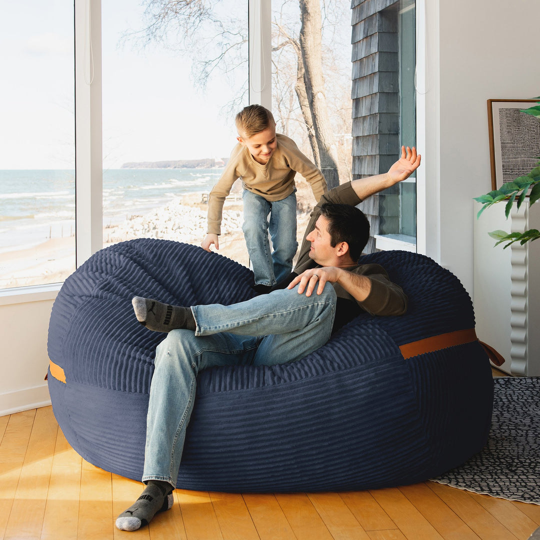 Kid playing on Big Joe Fuf XL Foam Beanbag Lounger Midnight Blue Corded Plush #color_midnight-blue