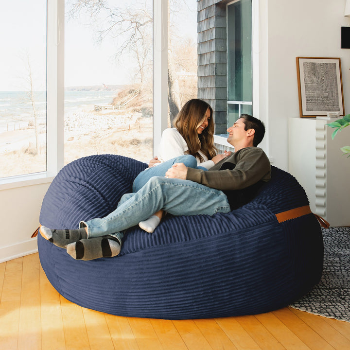 cuddling on Big Joe Fuf XL Foam Beanbag Lounger Midnight Blue Corded Plush #color_midnight-blue