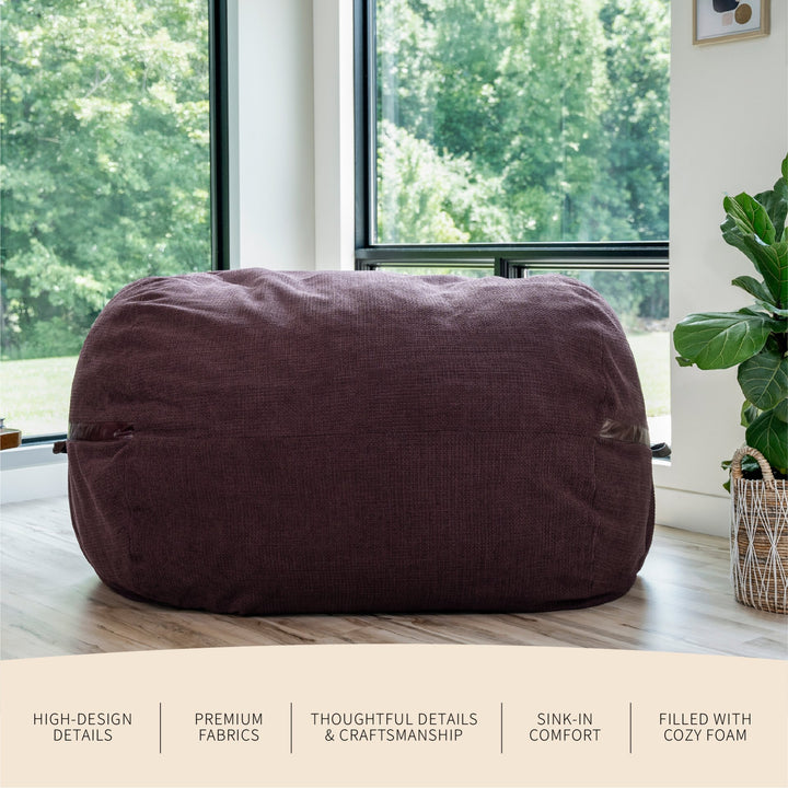Maroon bean bag chair in a room with large windows and a plant. #color_merlot-cloudweave