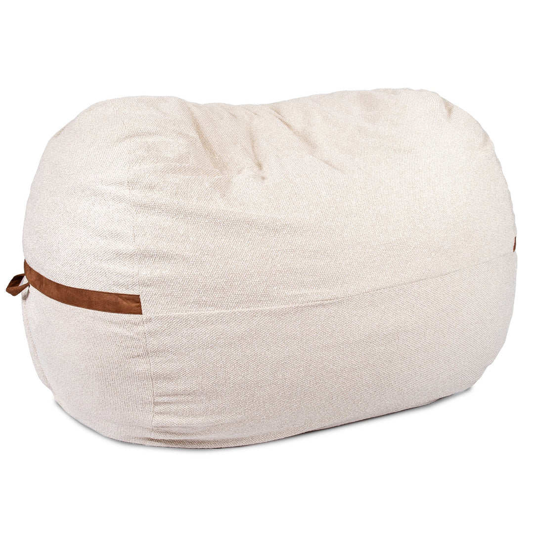 Beige bean bag chair with brown leather strap on a white background #color_sandstone-textured-boucle