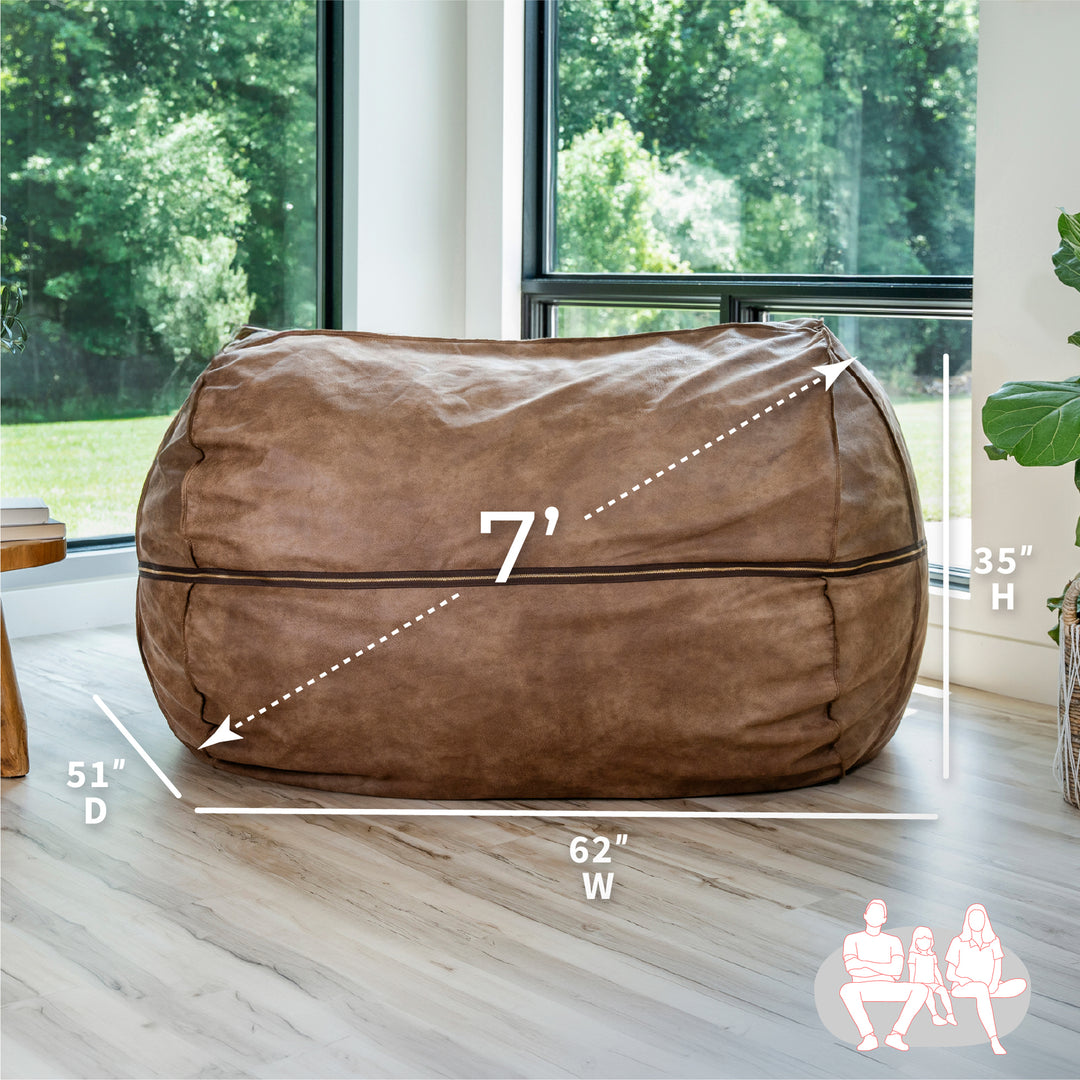 Brown bean bag chair with dimensions in a room with large windows. #color_coffee-soft-vegan-leather