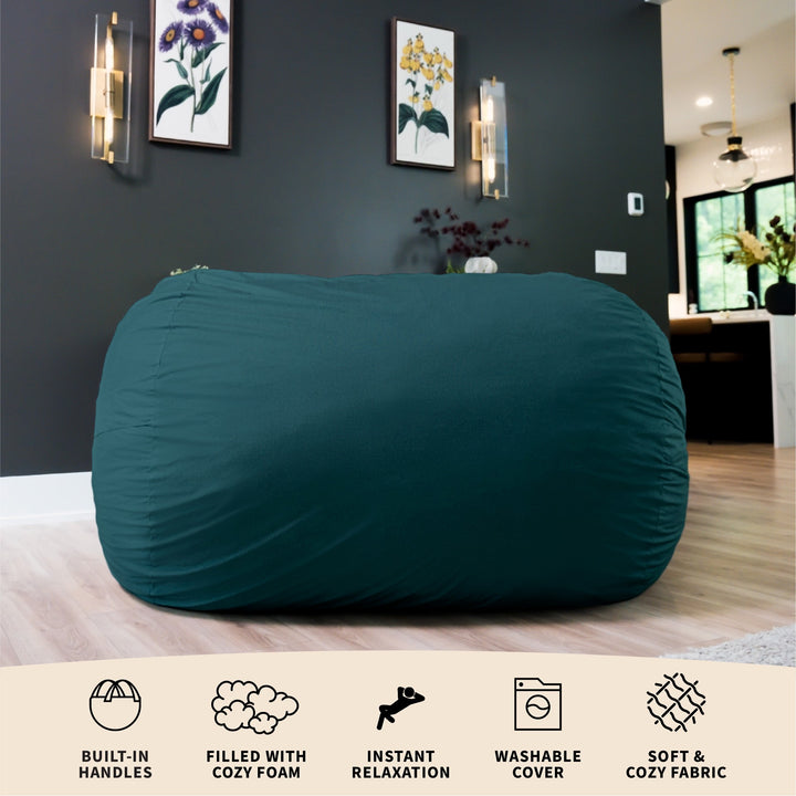 Teal bean bag chair in a room with decorative elements on the wall. #color_deep-sea-velveteen