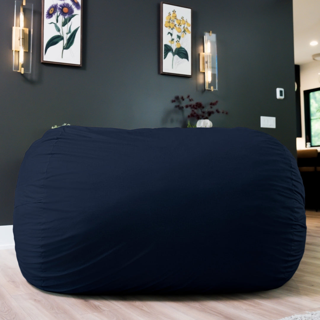 Navy blue bean bag chair in a room with dark walls and decorative  #color_cobalt-brushed-denim