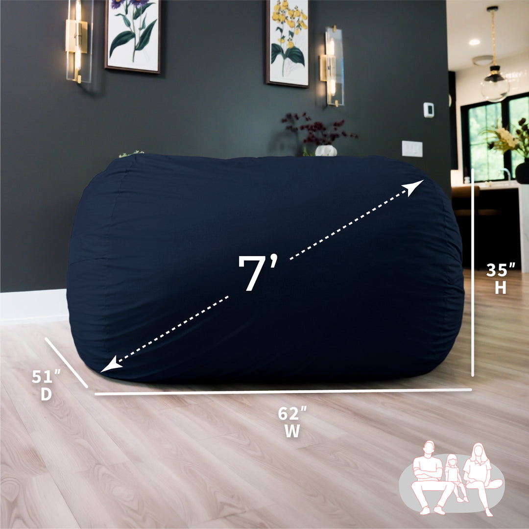 Navy bean bag with dimensions labeled in a room setting #color_cobalt-brushed-denim