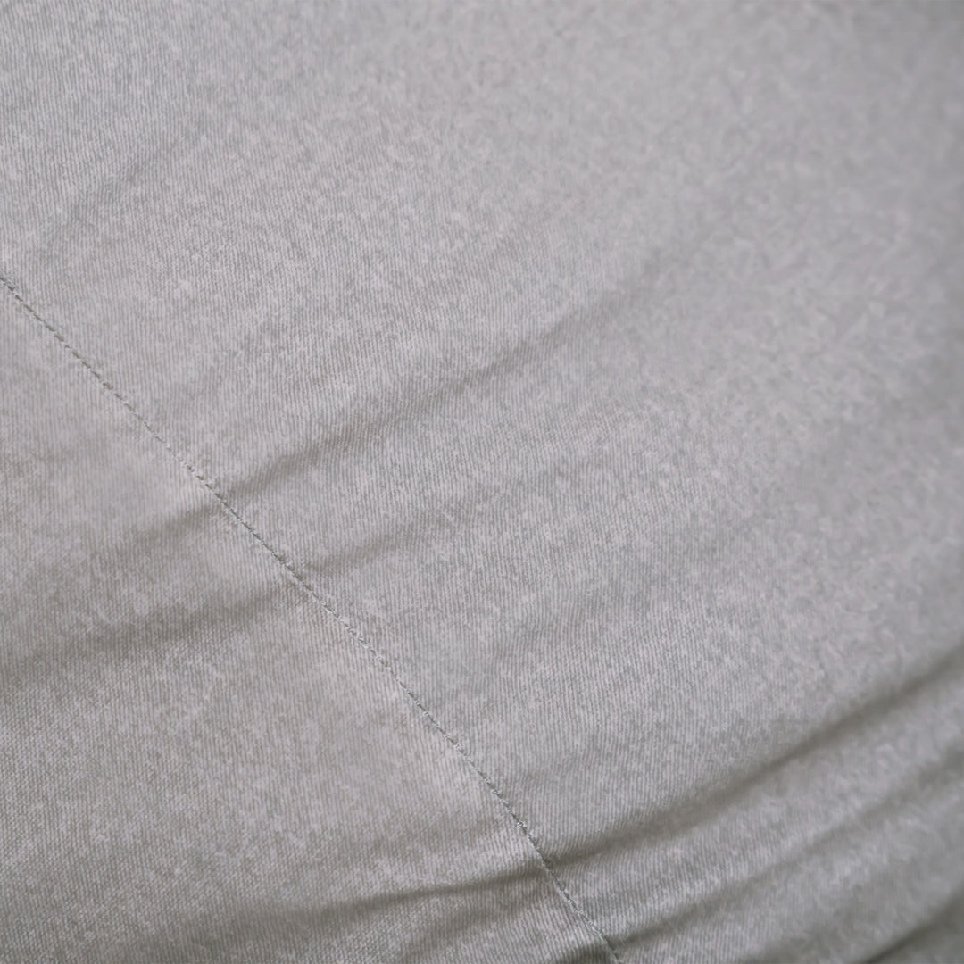 Close-up of a gray quilted fabric surface #color_fog-brushed-denim