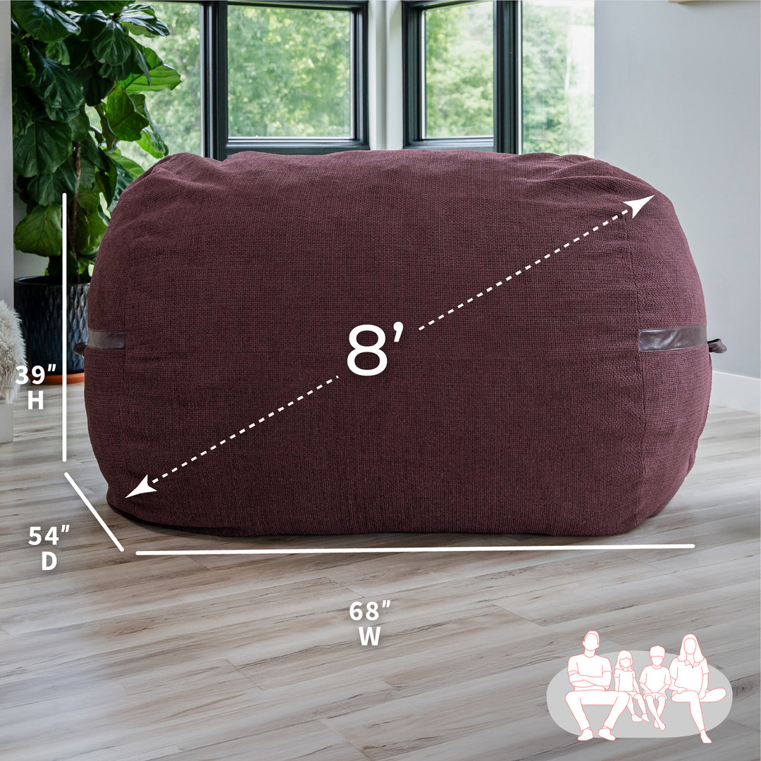 Merlot bean bag with dimensions labeled on a wooden floor. #color_merlot-cloudweave