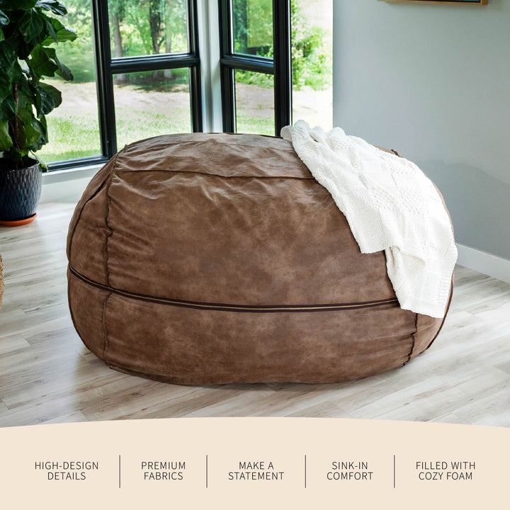 Brown bean bag chair with a white blanket in a room with large windows. #color_coffee-soft-vegan-leather