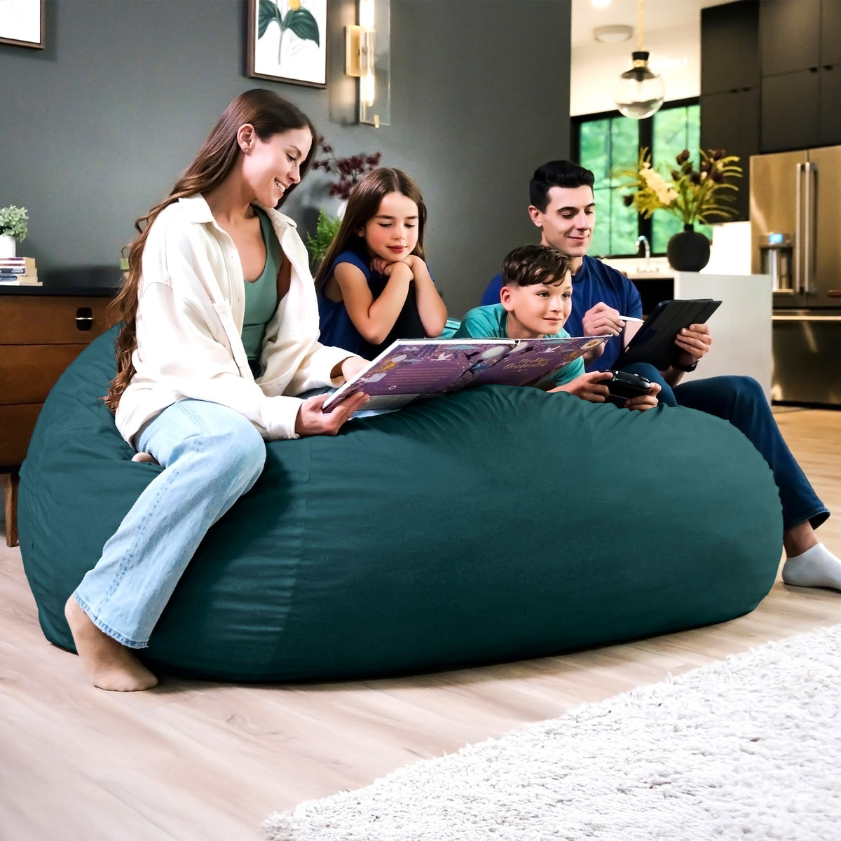 Family sitting on a teal bean bag in a living room. 