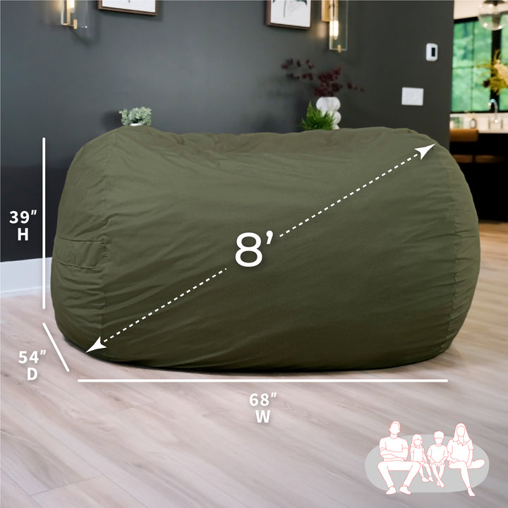 Green bean bag chair with dimensions on a wooden floor #color_forest-green-velveteen