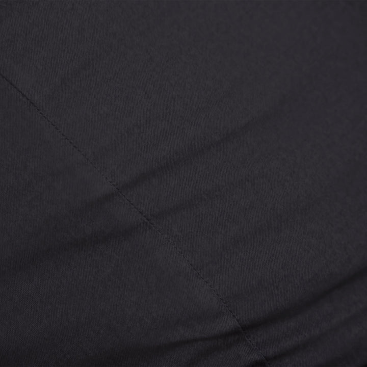 Close-up of black brushed denim fabric with visible texture #color_black-brushed-denim