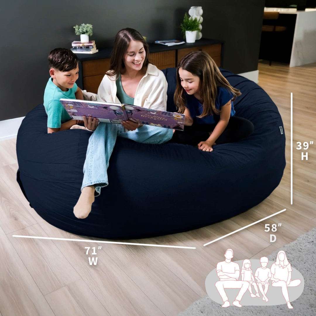 Woman and two children sitting on a navy bean bag reading a book, with measurements displayed. #color_cobalt-brushed-denim