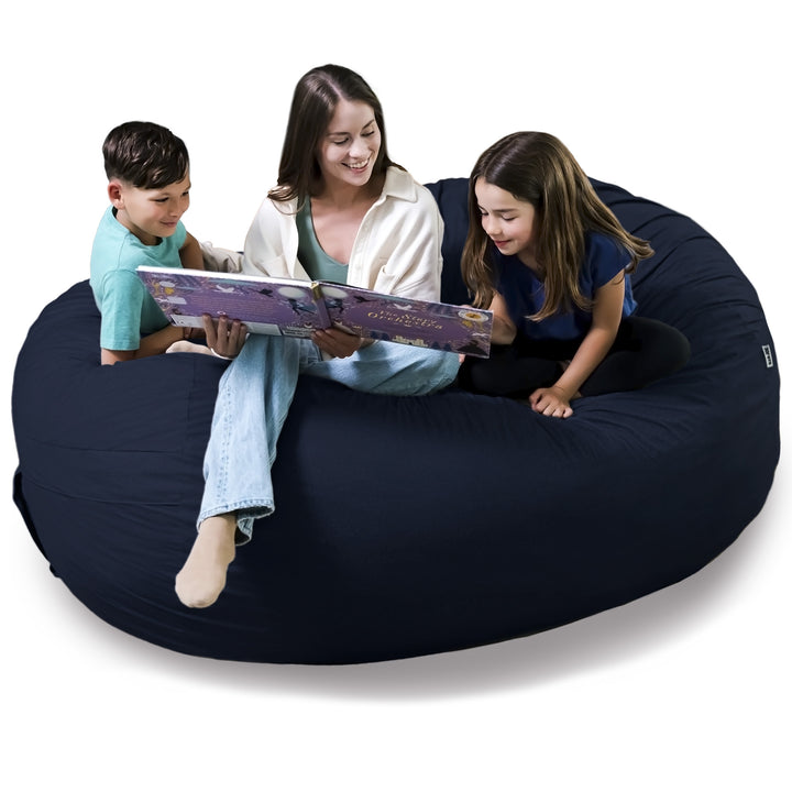 Woman reading a book to two children on a navy bean bag chair. #color_cobalt-brushed-denim