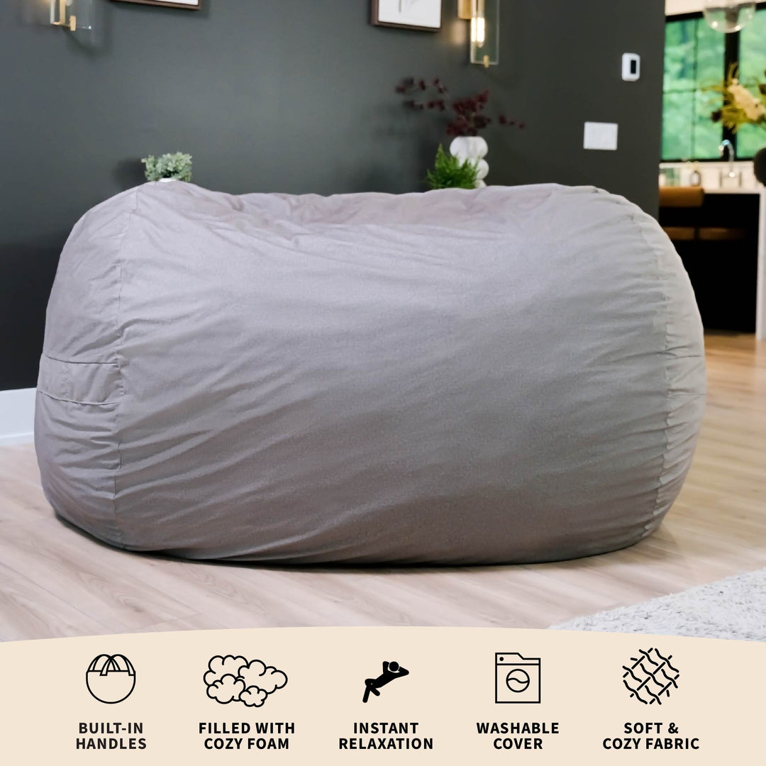 Gray bean bag chair on a bed with product features displayed below. #color_fog-brushed-denim