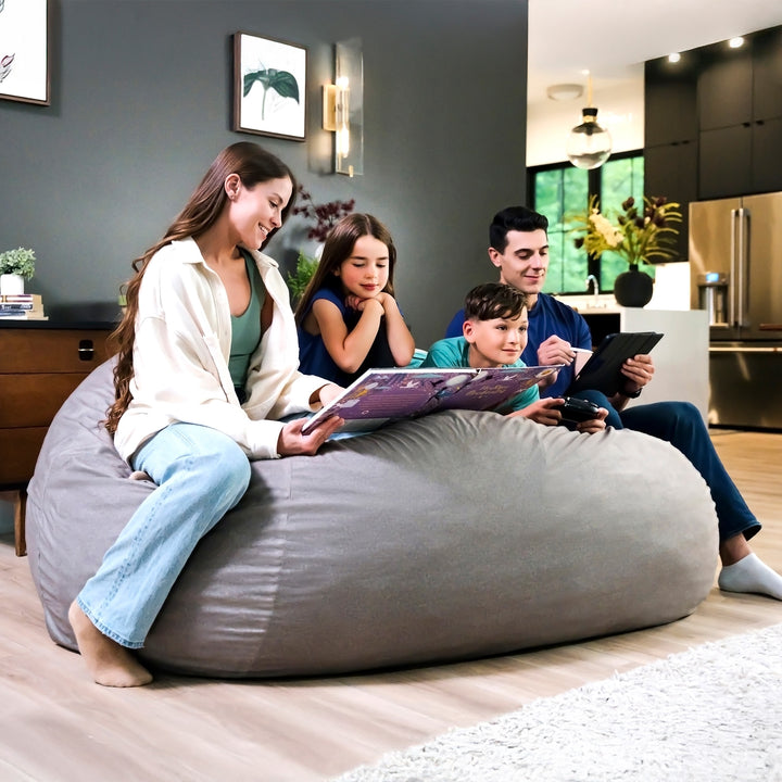 Family sitting on a large bean bag in a modern living room. #color_fog-brushed-denim