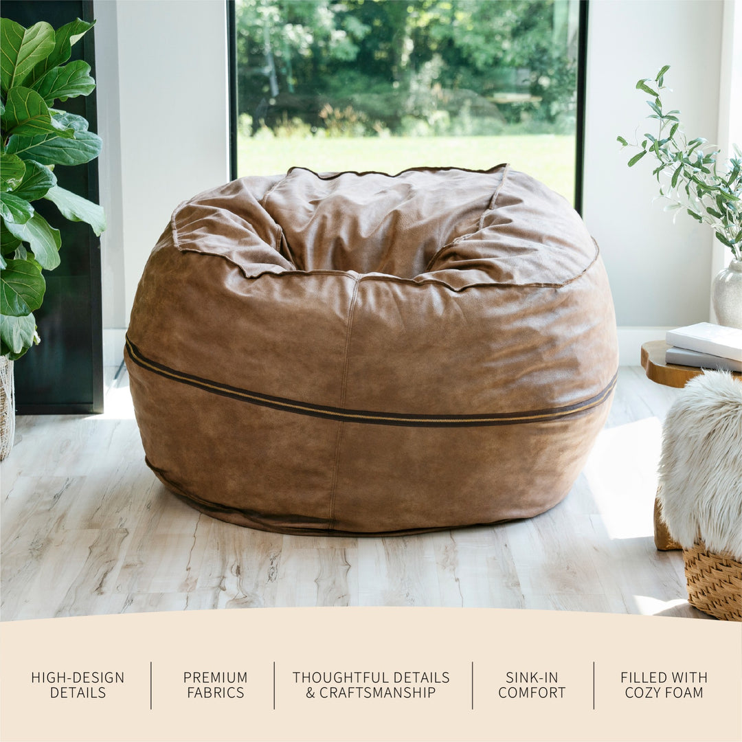 Brown bean bag chair in a room with plants and a window. #color_coffee-soft-vegan-leather