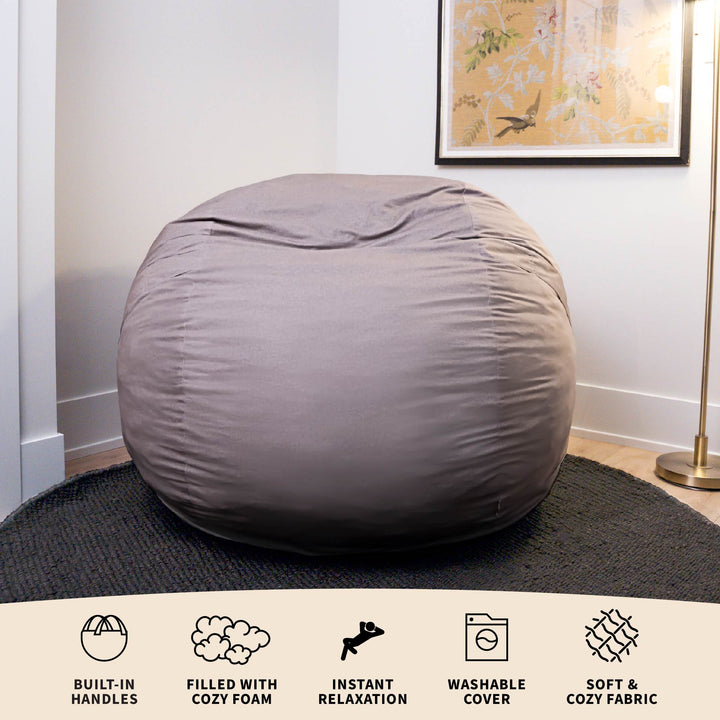 Gray bean bag chair in a room with a decorative painting on the wall. #color_fog-brushed-denim