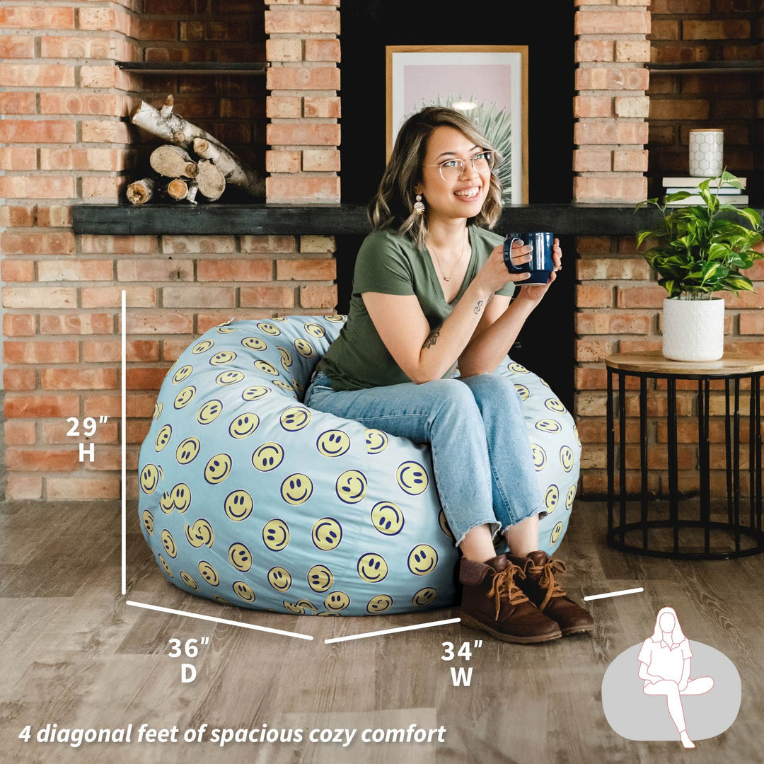 Woman sitting on a bean bag chair with smiley face pattern in a cozy room. #color_smiley-face-plush
