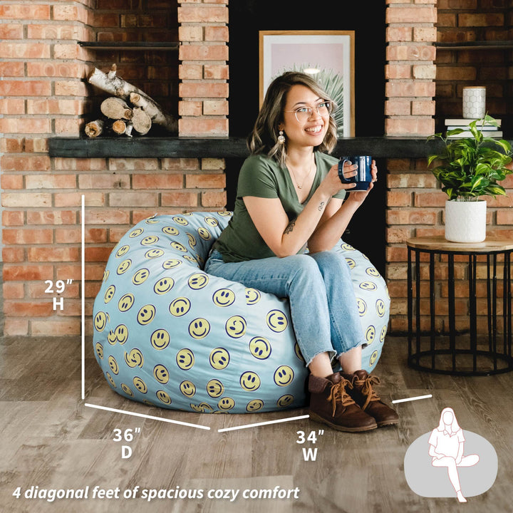 Woman sitting on a bean bag chair with smiley face pattern in a cozy room. #color_smiley-face-plush